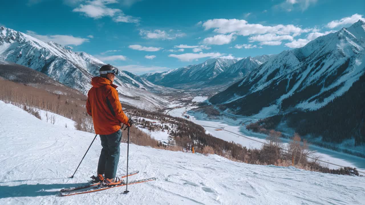 A Skier's Journey: Exploring Majestic Mountain Slopes and Scenic Views in a Winter Wonderland of Snow-Covered Peaks and a Vast Valley below