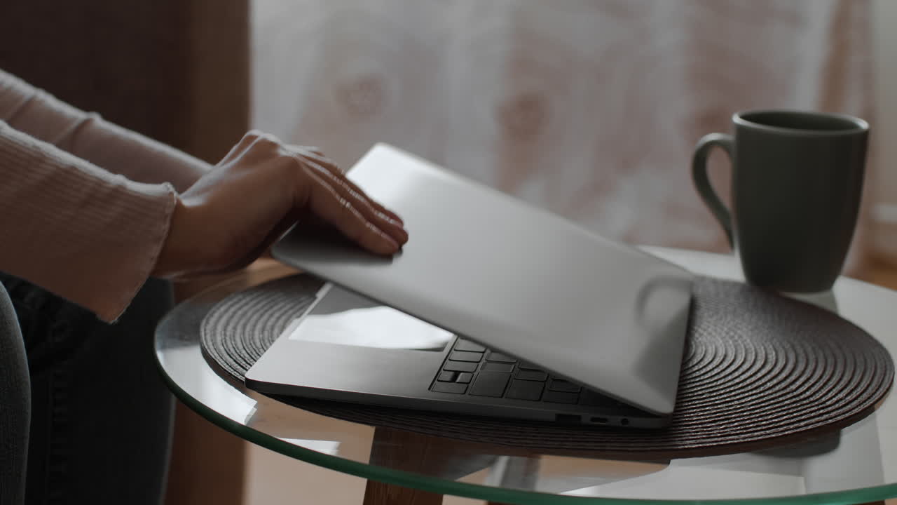 Woman Working on Laptop at Home