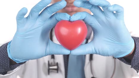 doctor holding a red heart