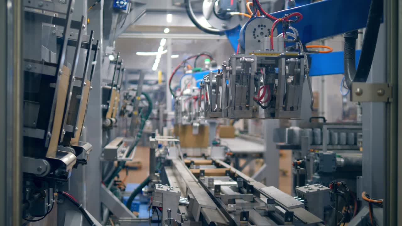 Plant conveyor moves carton boxes in a row. Robotic production line.
