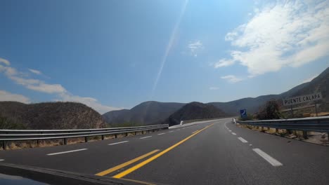 driving through a mexican highway entering the state of oaxaca