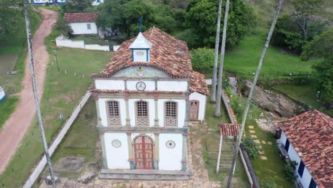 Aerial-drone-view-of-colonial-style-houses-around-rocky-hills-1