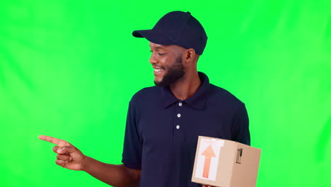 black man, box and pointing on green screen