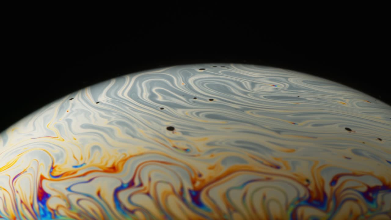 Macro Abstract Shot of Soapy Film Surface with Grey and Yellow Streaks Moving