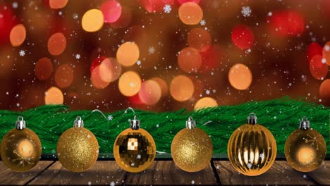 animación de copos de nieve cayendo sobre luces navideñas intermitentes y bolas de oro.