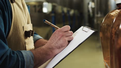 worker writing on clipboard