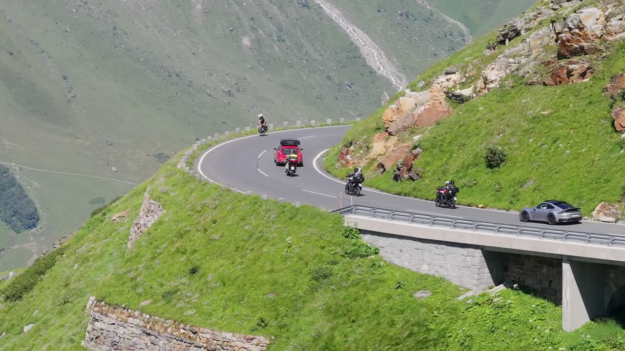 Summer traffic winds through alpine heights in Austria, Grossglockner pass