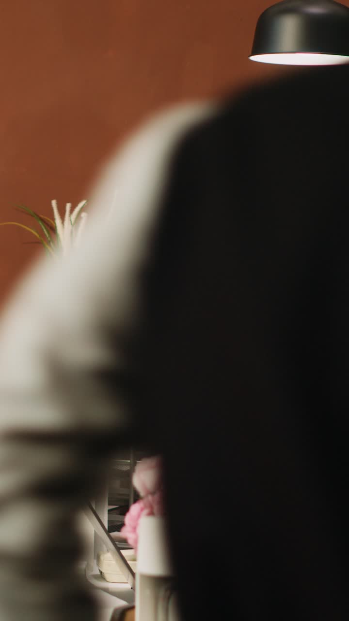 Vertical video Hotel worker welcoming guests at hotel