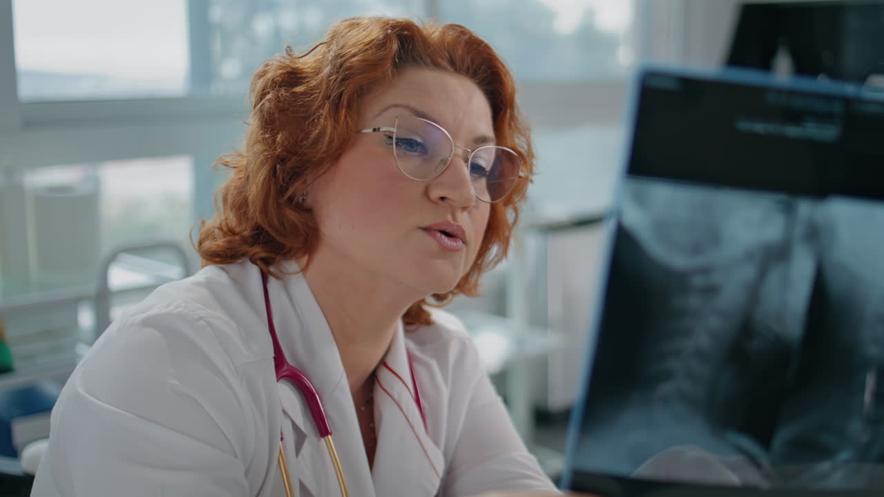 Radiologist looking x-ray image in clinic closeup. Skilled doctor interpreting