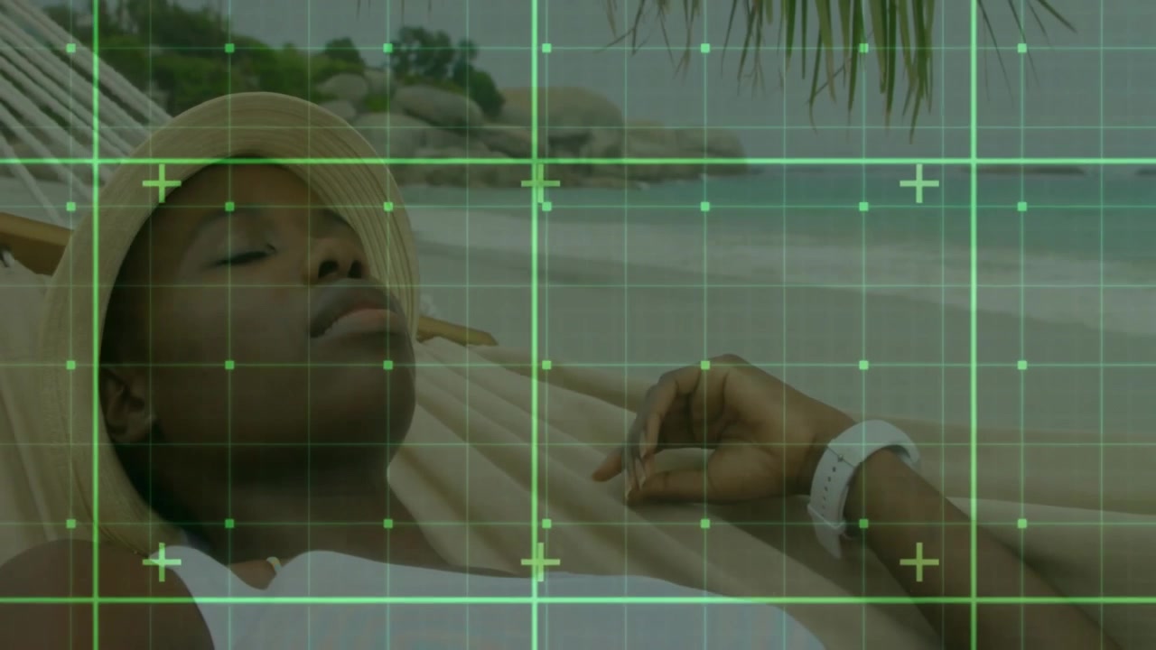 Woman reclining on hammock at beach, initiating animated green grid scanning body for health scan