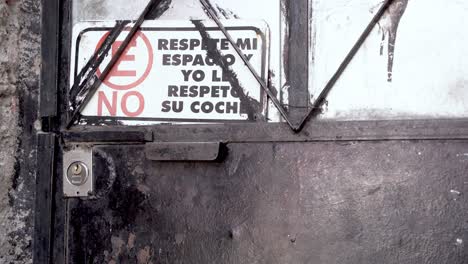 sign on old metal door