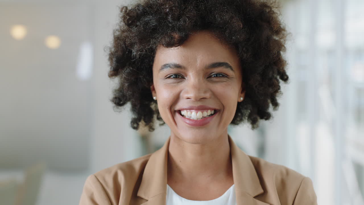 portrait happy business woman with afro smiling enjoying successful career proud entrepreneur in office workplace testimonial 4k footage
