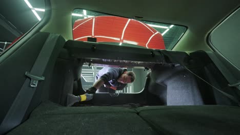 professional car cleaning. сar wash. interior detailing. dry clean and detail a car interior. deep seats cleaning. wiping foam in car wash. cleaning the car panel from dust. a vacuum cleaner