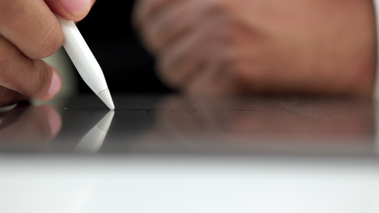 Businessman signing a business contract with stylus pen on tablet. Man signing contract on tablet at office. Business and technology concept. Electronic signature concept