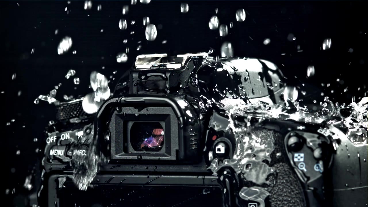Water Splashing on a DSLR Camera in Slow Motion
