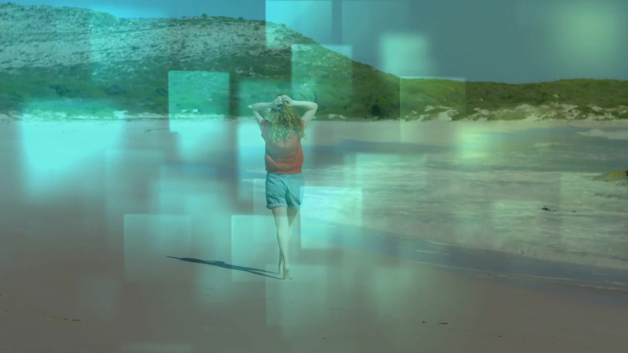 Woman walking toward shoreline, pausing to view sea while squares drifting across frame travel