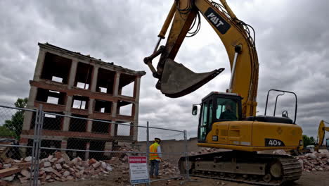 demolition of a building with excavator