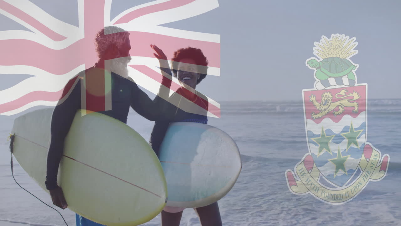 On beach, surfers with Cayman Islands flag and coat of arms animation