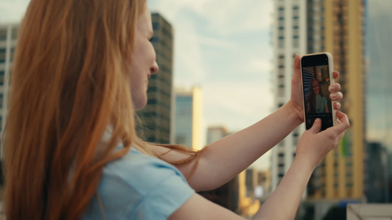 Woman taking a selfie on a rooftop
