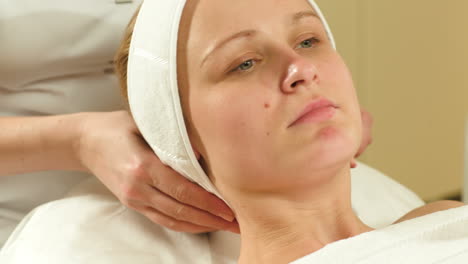 woman being prepared for facial spa procedures