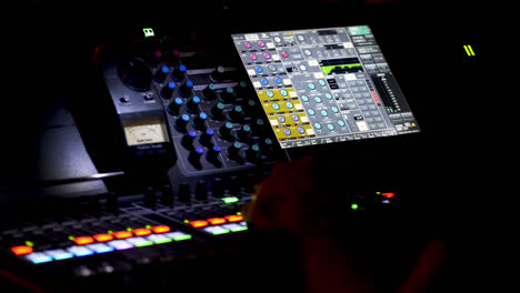 person operating sound editing table, panoramic view