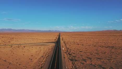 Modern-black-car-driving-in-the-desert-on-a-street-from-California-to-Arizona