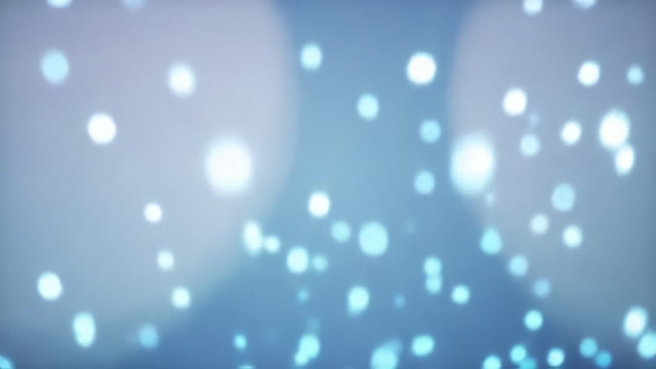 Immerse yourself in a mesmerizing display of blue bokeh lights that create a calming and magical ambiance at night. Enjoy the beauty of this enchanting visual experience.