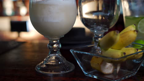 Banana-cocktail-at-mexican-bar-panning-up