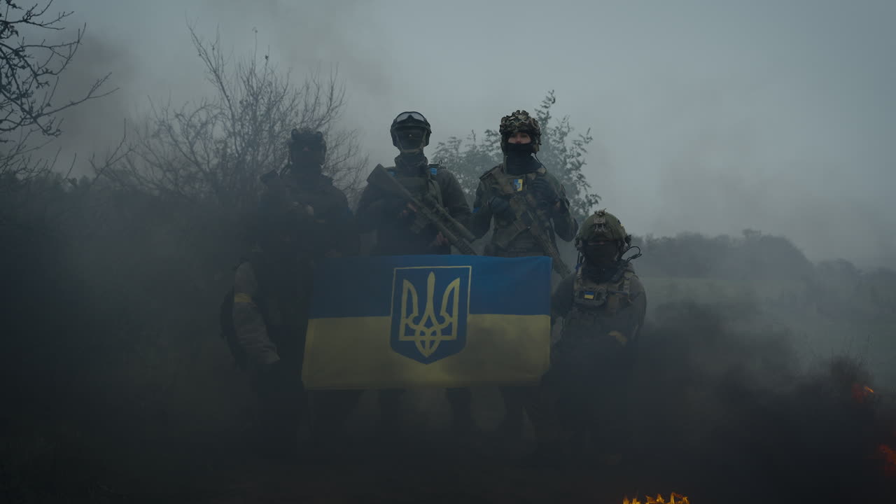 Ukrainian Soldiers with Flag in a Foggy Landscape