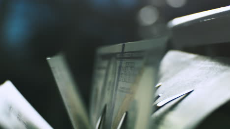 close-up of money being processed by a machine