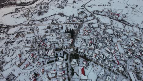 village of voskopoja with streets, guesthouses and hotels covered in snow, mountain tourism in albania