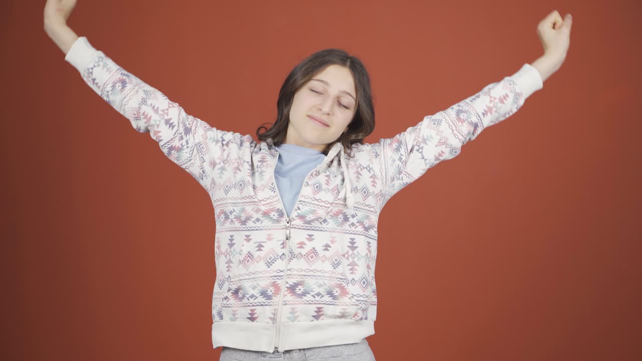 Sleepy young woman yawns.