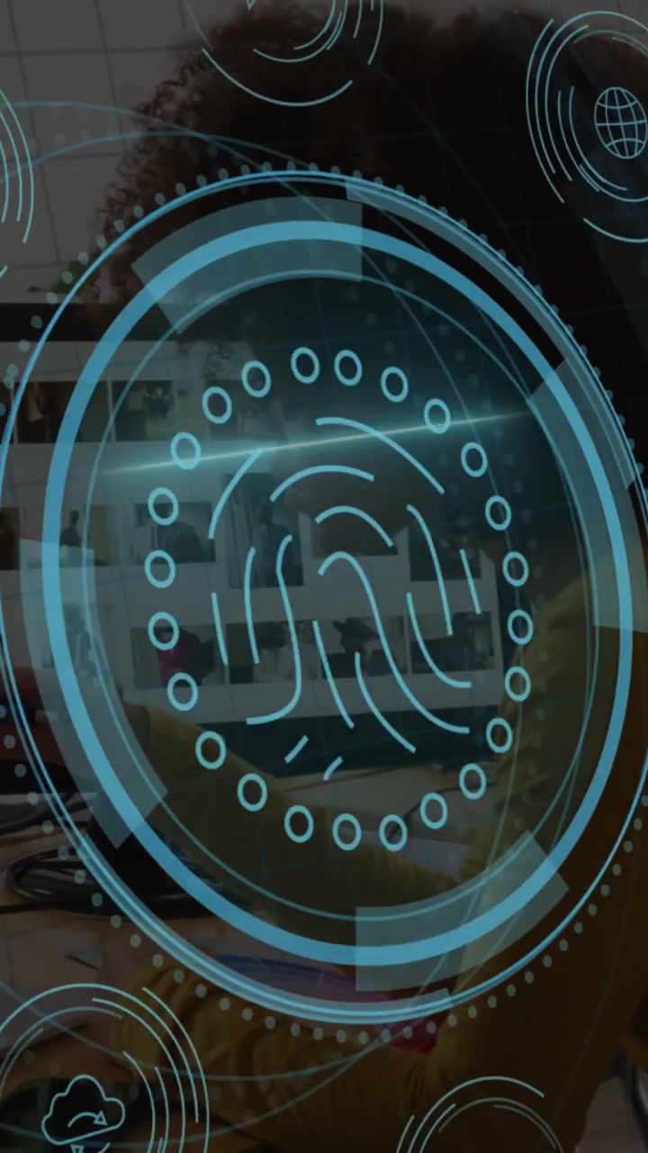 Vertical video: Woman reaching for phone and PC, activating security HUD protecting data with scan