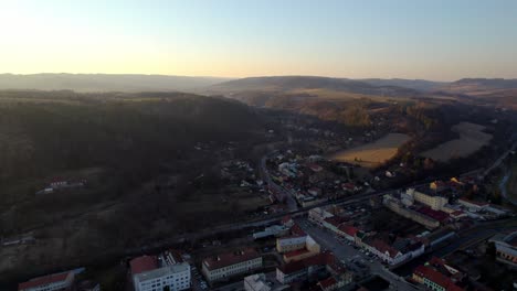 aerial flight over the town of letovice to the křetínka dam at sunset in the czech republic