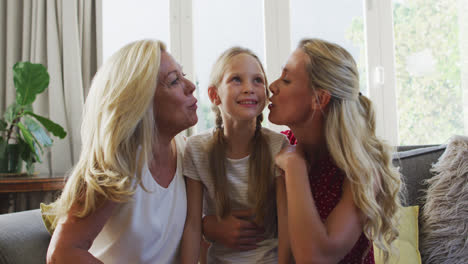 caucasian woman spending time with her mother and her daughter