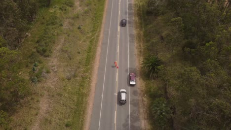 Road-construction-worker-directing-traffic-in-Uruguay