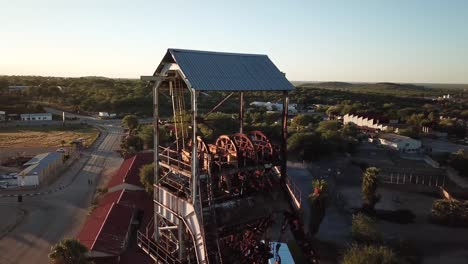 beautiful old rusty mine shaft in the middle of an old mining town in namibia called tsumeb