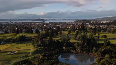 golf club pools across countryside whakarewarewa village in rotorua, north island, new zealand