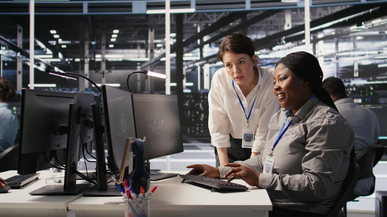 Vertical video Data center team leader and IT expert reviewing performance dashboards of AI