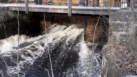 water gate belonging to an old abandon ironworks with cascading water