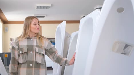 woman shopping for a bathtub in a showroom