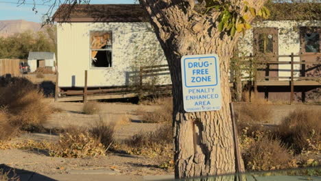 dug free zone signage on tree, greenville, goblin valley state park, utah