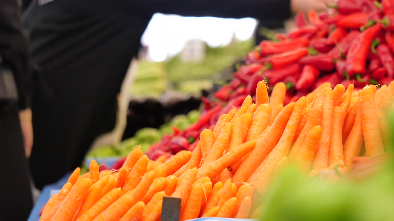 Fresh Carrots and Peppers at a Vibrant Market