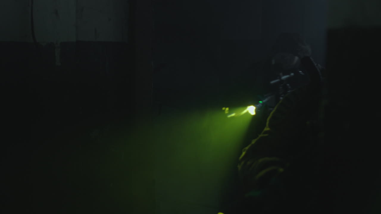 Masked Person in a Dark Room with a Light