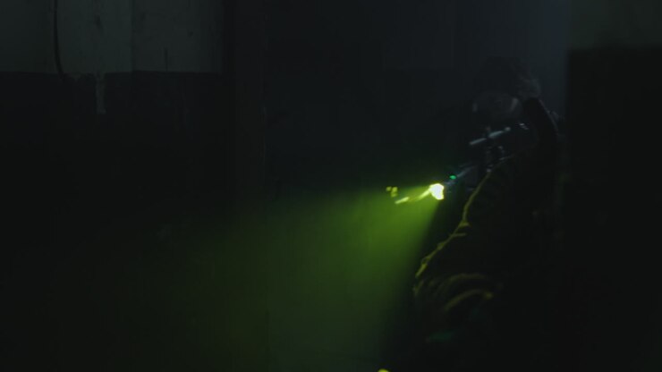 Masked Person in a Dark Room with a Light