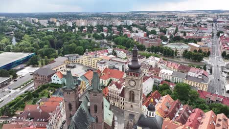 Gothic-Cathedral-of-Holy-Spirit-and-White-Tower,-drone-flyover-historic-landmarks-in-Hradec-Kralove,-Czechia