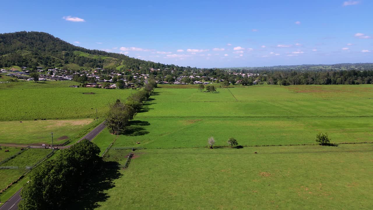 Forward moving aerial footage of farmland surrounding Kyogle in Northern New South Wales, Australia