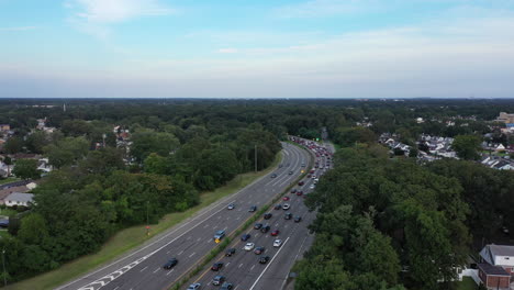 an aerial view next to a parkway in the evening at rush hour