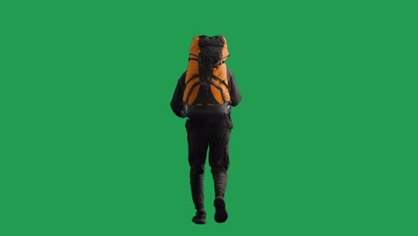 person hiking with backpack on green screen