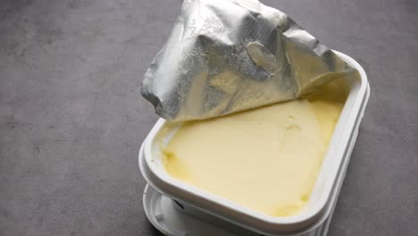 open butter container